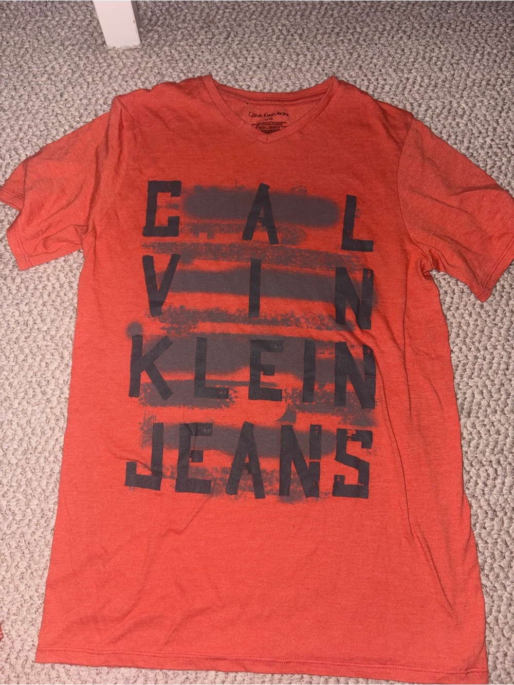 Calvin Klein Jeans Orange Graphic V-Neck Tee with Black Print